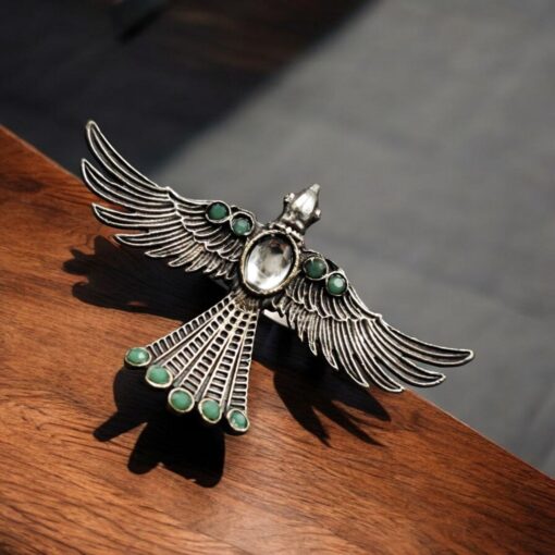 Brass bird ring with sparkling stones, featuring an elegant and intricate design perfect for any occasion.