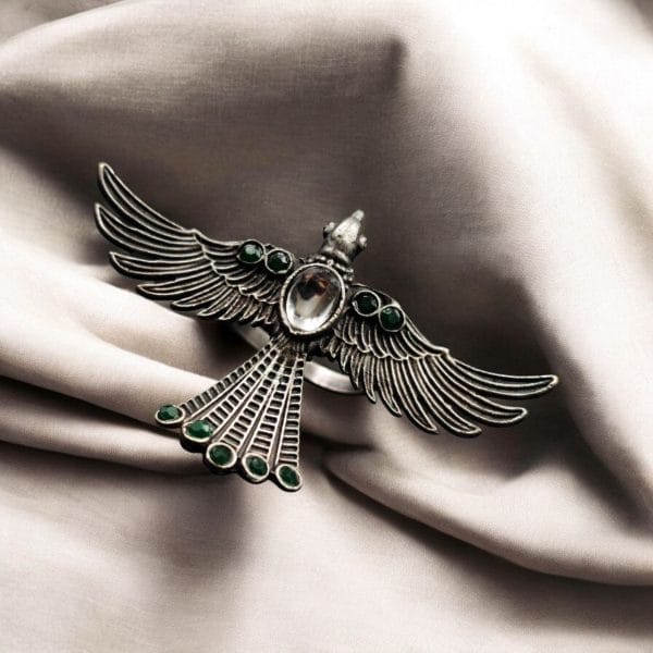 Brass bird ring with sparkling stones, featuring an elegant and intricate design perfect for any occasion.