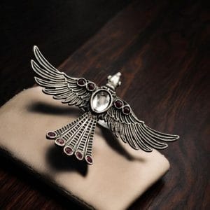 Brass bird ring with sparkling stones, featuring an elegant and intricate design perfect for any occasion.