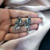 Elegant parrot design brass earrings featuring intricate craftsmanship, lightweight structure, and a timeless charm, perfect for festive and casual occasions.