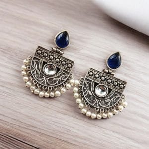 A pair of elegant stone stud earrings made from premium brass, featuring sparkling stones, perfect for every occasion."