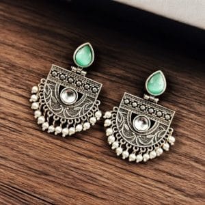 A pair of elegant stone stud earrings made from premium brass, featuring sparkling stones, perfect for every occasion."
