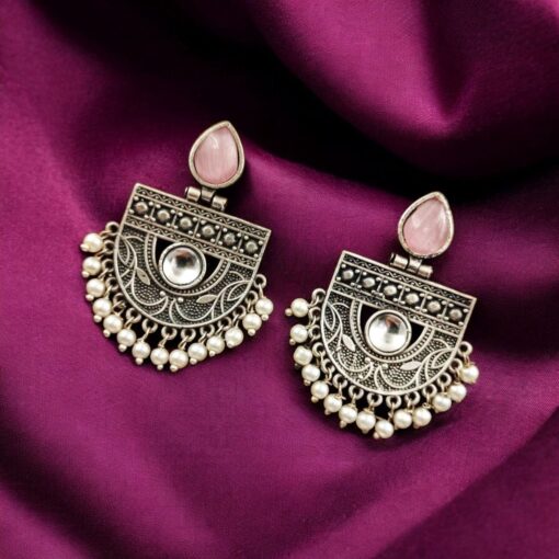 A pair of elegant stone stud earrings made from premium brass, featuring sparkling stones, perfect for every occasion."