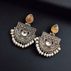 A pair of elegant stone stud earrings made from premium brass, featuring sparkling stones, perfect for every occasion.