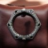 Elegant openable brass stone kada bracelet with intricate stone detailing and adjustable fit. Caption:
