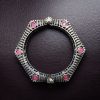 Elegant openable brass stone kada bracelet with intricate stone detailing and adjustable fit. Caption: