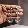 Elegant Chandbali Stud Earrings in Brass with Silver Replica Finish