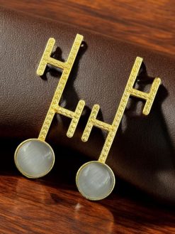 Goldplated Monalisa stone stud earrings with a sleek contemporary design, perfect for modern style lovers.