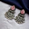 Elegant brass stud earrings with beautiful stone detailing, perfect for women.