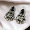 Elegant brass stud earrings with beautiful stone detailing, perfect for women.