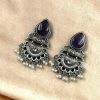 Elegant brass stud earrings with beautiful stone detailing, perfect for women.