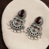 Elegant brass stud earrings with beautiful stone detailing, perfect for women.