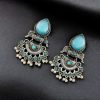 Elegant brass stud earrings with beautiful stone detailing, perfect for women.