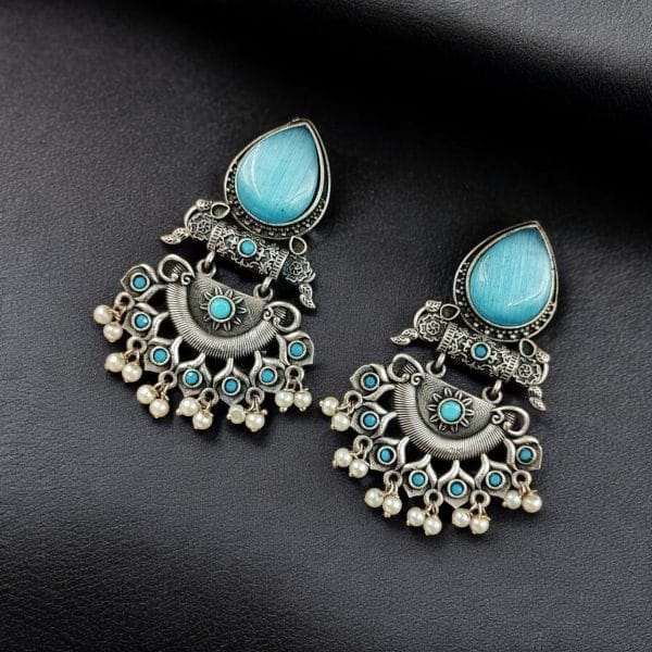 Elegant brass stud earrings with beautiful stone detailing, perfect for women.