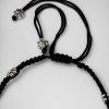 Elegant daily wear anklets with intricate thread work and flower charms in German silver, designed for a graceful and comfortable fit.
