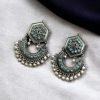 Brass stone stud earrings with intricate design, perfect for ethnic occasions, offering a blend of elegance and tradition.