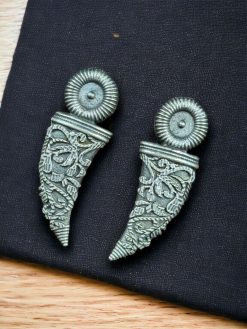 A pair of perfectly crafted brass stud earrings with a polished finish, offering timeless elegance and versatile style for casual and formal wear.
