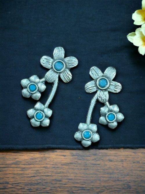 Elegant flower stone stud brass earrings with a delicate floral design and shimmering stones, perfect for adding sophistication to any outfit.