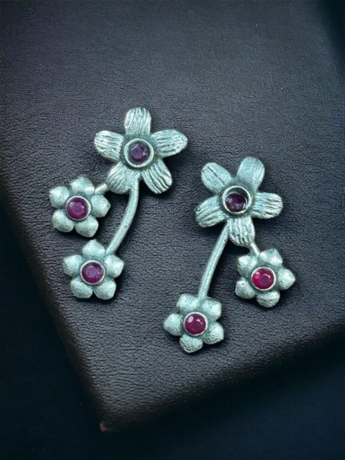 Elegant flower stone stud brass earrings with a delicate floral design and shimmering stones, perfect for adding sophistication to any outfit.