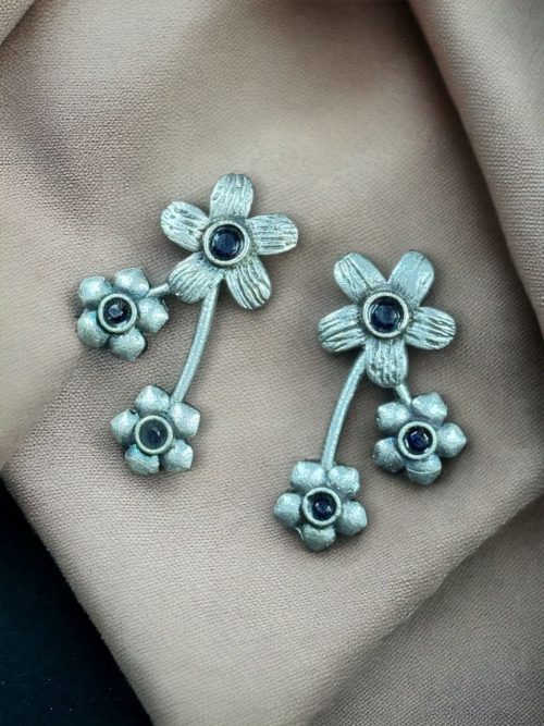 Elegant flower stone stud brass earrings with a delicate floral design and shimmering stones, perfect for adding sophistication to any outfit.