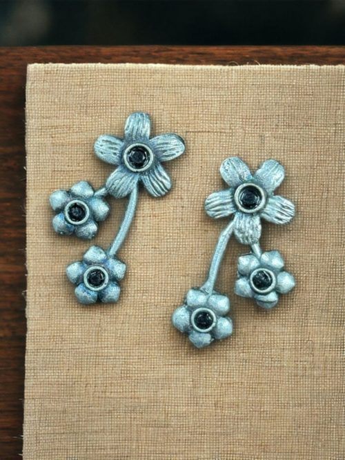 Elegant flower stone stud brass earrings with a delicate floral design and shimmering stones, perfect for adding sophistication to any outfit.