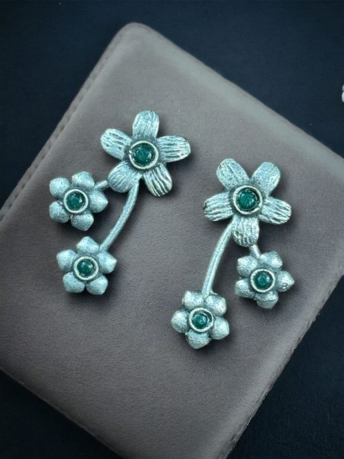 Elegant flower stone stud brass earrings with a delicate floral design and shimmering stones, perfect for adding sophistication to any outfit.