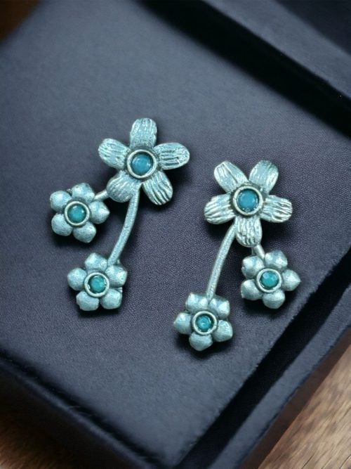 Elegant flower stone stud earrings with a delicate floral design and shimmering stones, perfect for adding sophistication to any outfit.