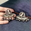 Perfect Ethnic Brass Stone Stud Earrings featuring an intricate peacock design, adorned with sparkling stones and delicate ghungroo charms, ideal for traditional wear