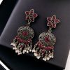 Elegant ethnic hanging stone stud earrings crafted from brass, perfect for any occasion.
