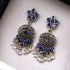 Elegant ethnic hanging stone stud earrings crafted from brass, perfect for any occasion.