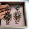 Elegant ethnic hanging bird-styled German silver stone stud earrings with intricate detailing, perfect for any occasion.