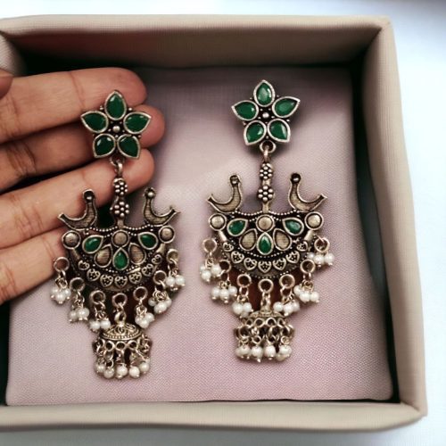 Elegant ethnic hanging bird-styled German silver stone stud earrings with intricate detailing, perfect for any occasion.