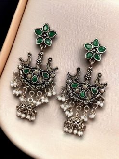 Elegant ethnic hanging bird-styled German silver stone stud earrings with intricate detailing, perfect for any occasion.