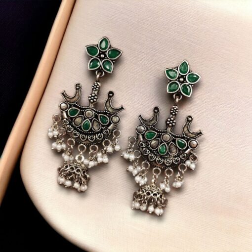 Elegant ethnic hanging bird-styled German silver stone stud earrings with intricate detailing, perfect for any occasion.