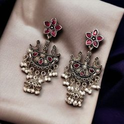 Elegant ethnic hanging bird-styled German silver stone stud earrings with intricate detailing, perfect for any occasion.