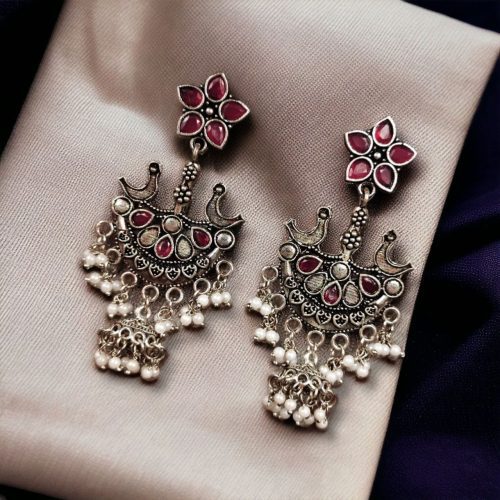 Elegant ethnic hanging bird-styled German silver stone stud earrings with intricate detailing, perfect for any occasion.