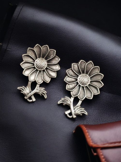 Brass sunflower stud earrings with an elegant design, perfect for ethnic wear and festive occasions.