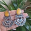 Elegant brass studs earrings with beautiful stone detailing, perfect for women.