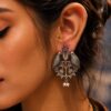 Antique-style silver replica bird stud earrings in brass with intricate vintage design, perfect for traditional and modern outfits