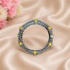 Elegant openable brass stone kada bracelet with intricate stone detailing and adjustable fit. Caption: