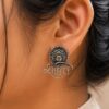 Brass Shakti Stud Earrings with intricate detailing, perfect for ethnic wear.