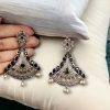 Elegant brass hanging stud earrings with intricate detailing and a beautiful stone embellishment, perfect for an ethnic and sophisticated look.