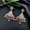 Elegant brass hanging stud earrings with intricate detailing and a beautiful stone embellishment, perfect for an ethnic and sophisticated look.