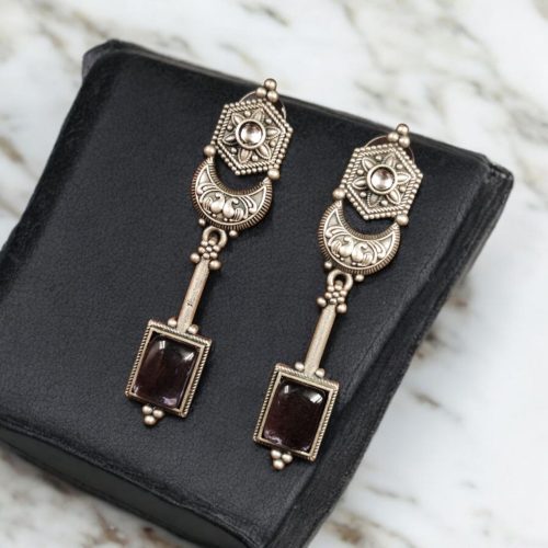 Traditional silver replica earrings with oxidized dangler design and stone embellishments, perfect for adding a touch of vintage elegance to any outfit.