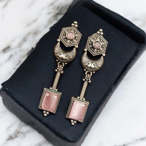 Traditional silver replica earrings with oxidized dangler design and stone embellishments, perfect for adding a touch of vintage elegance to any outfit.