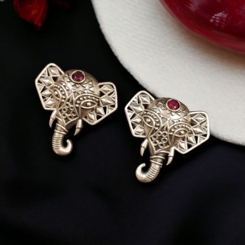Unique brass elephant stud earrings featuring intricate detailing and embedded stones, perfect for an elegant and cultural look.