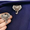 Unique brass elephant stud earrings featuring intricate detailing and embedded stones, perfect for an elegant and cultural look.
