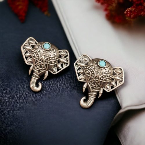 Unique brass elephant stud earrings featuring intricate detailing and embedded stones, perfect for an elegant and cultural look.