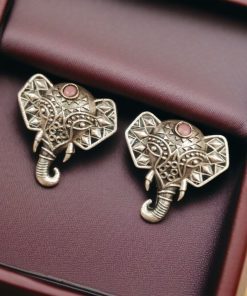Unique brass elephant stud earrings featuring intricate detailing and embedded stones, perfect for an elegant and cultural look.