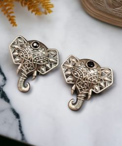 Unique brass elephant stud earrings featuring intricate detailing and embedded stones, perfect for an elegant and cultural look.